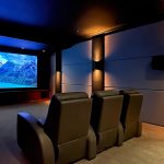 Home theater with projection screen on display at Custom Audio Video's showroom