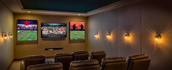 home theater with 5 flat screen televisions
