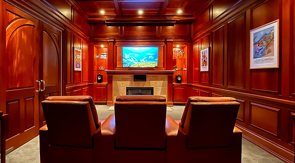wood paneled home theater demo room at Custom Audio Video