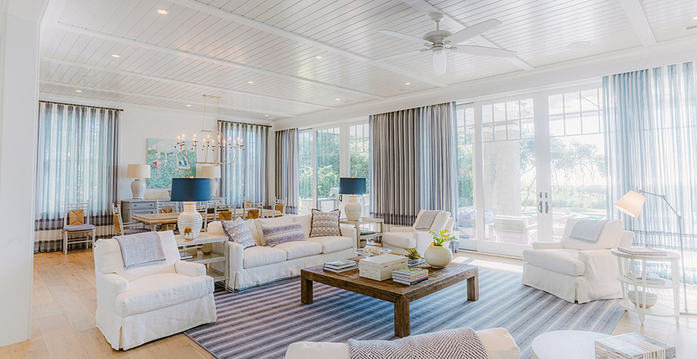 Lighting controlled living room and dining room in beachfront home